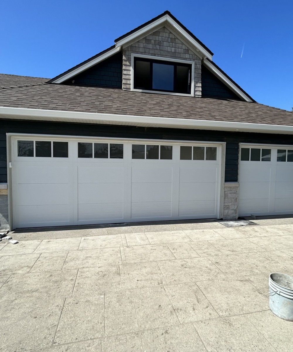 Clopay Coachman Series CG11 garage door with REC 13 windows installed in Ladner BC