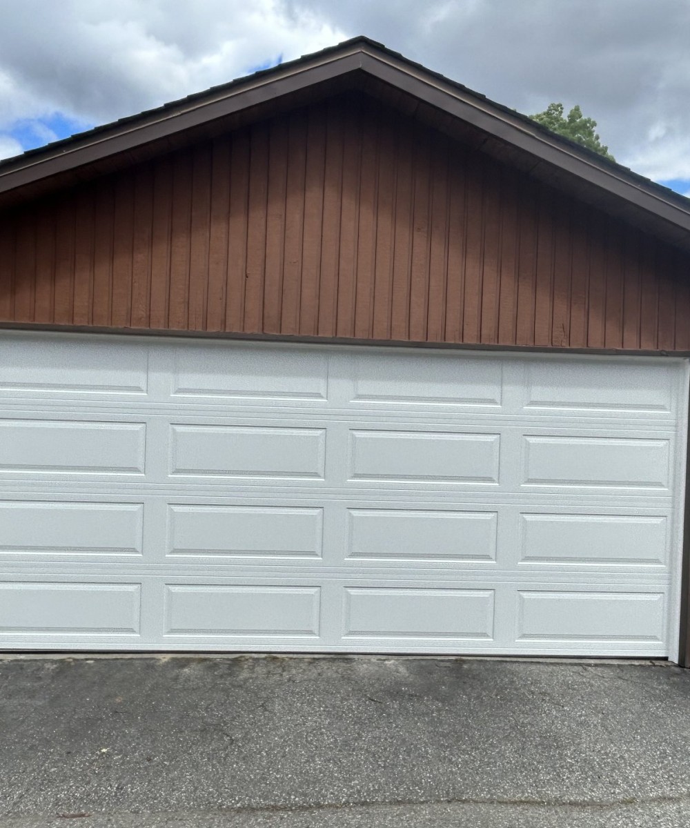 Hormann garage door installation in Vancouver - white Long Panel door
