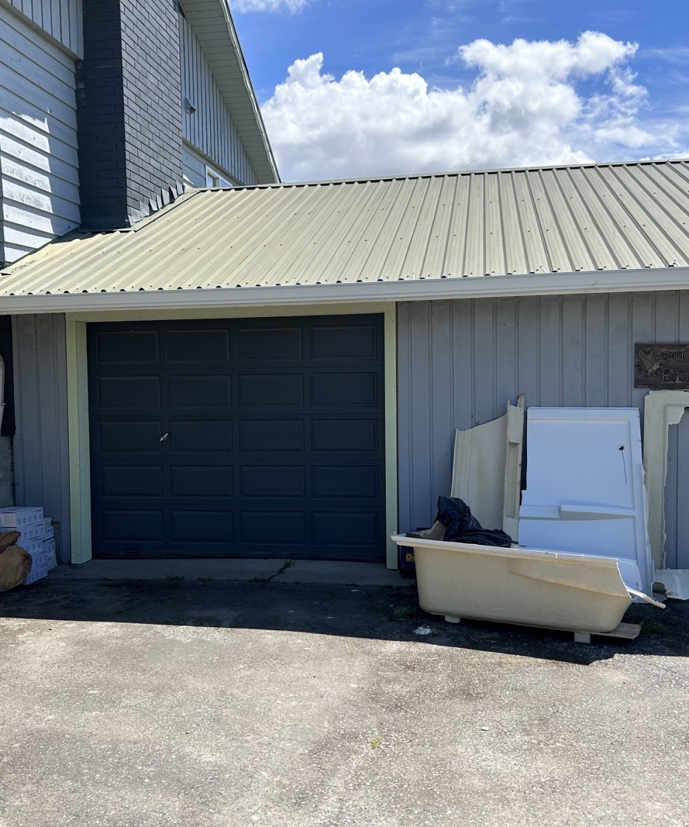 White Hormann 3400 long panel garage door with Liftmaster opener in Westham Island