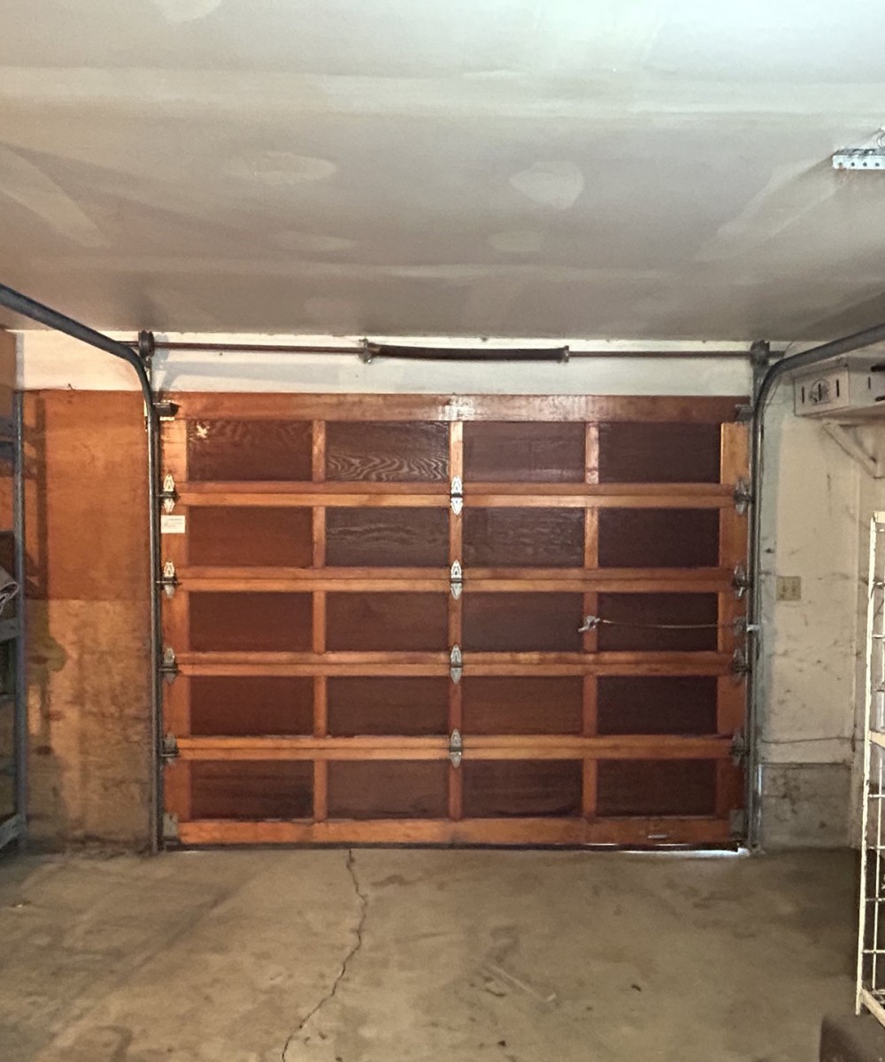 White Hormann 3400 long panel garage door with Liftmaster opener in Westham Island