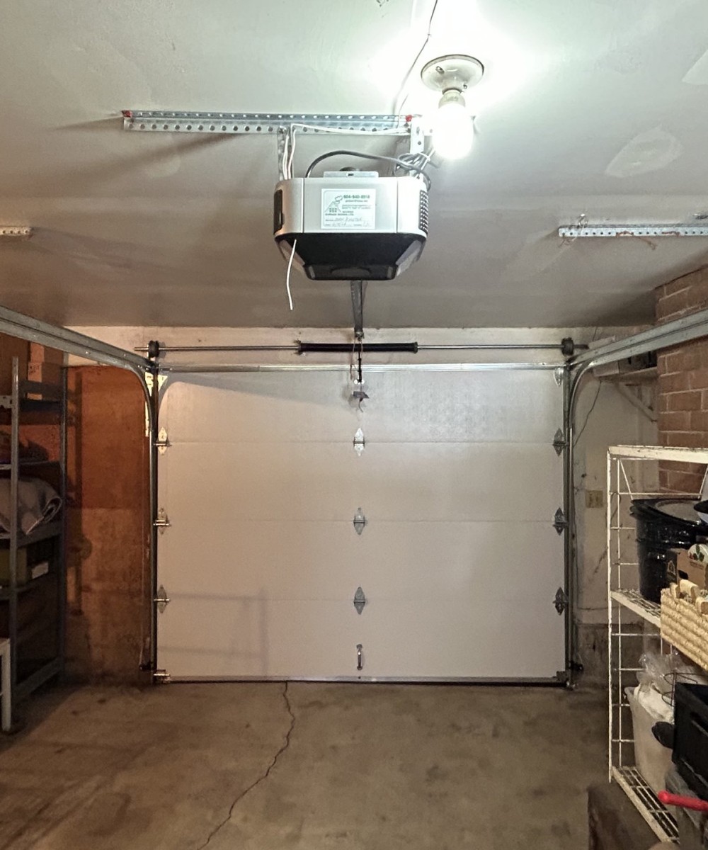 White Hormann 3400 long panel garage door with Liftmaster opener in Westham Island