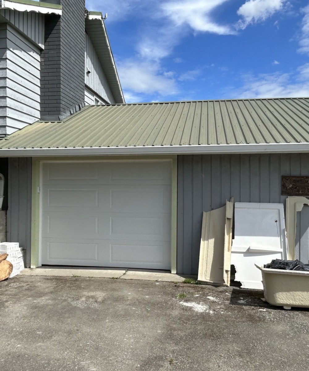 White Hormann 3400 long panel garage door with Liftmaster opener in Westham Island