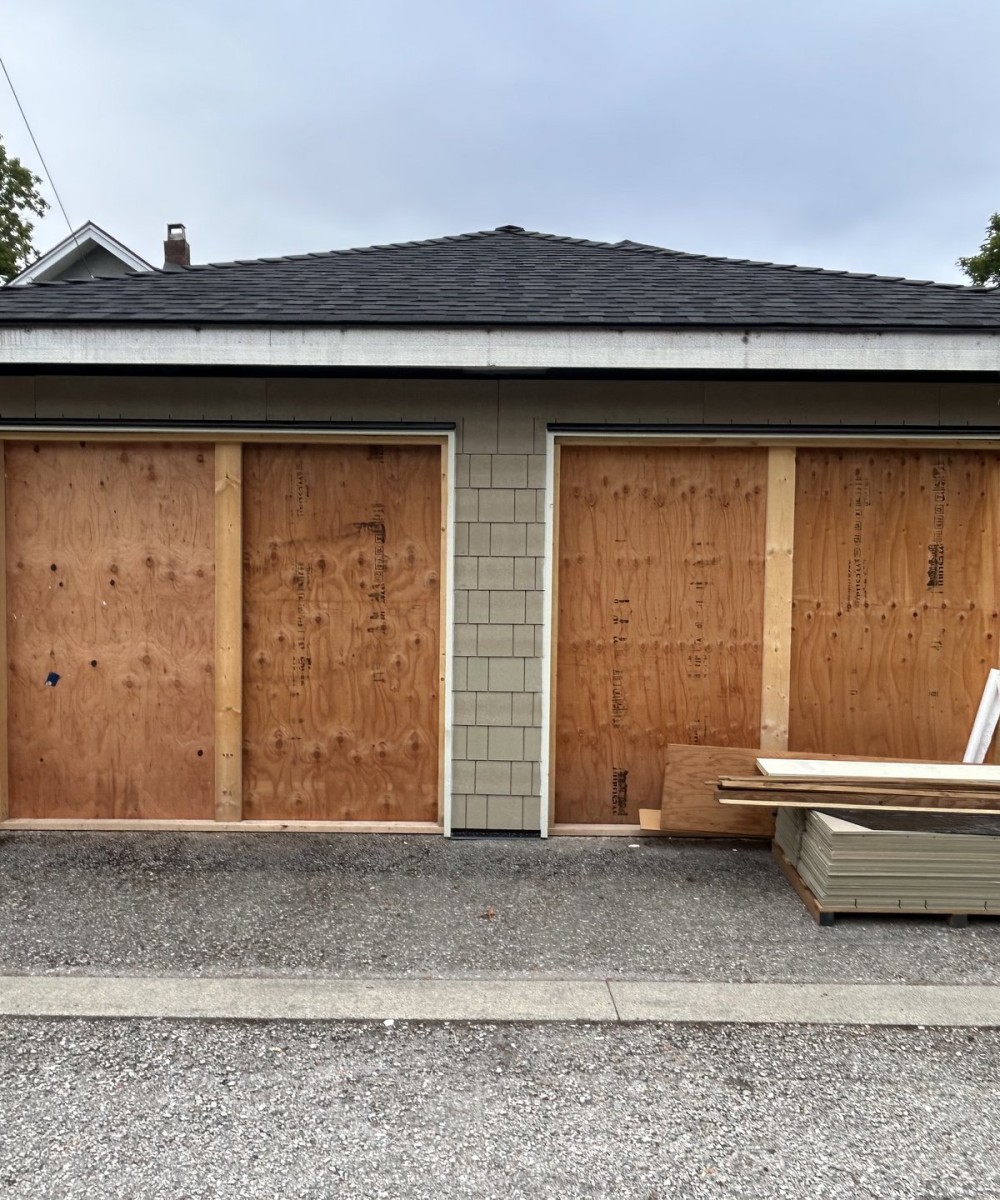 Amarr Olympus OL3200 black garage door with glass top sections in Vancouver