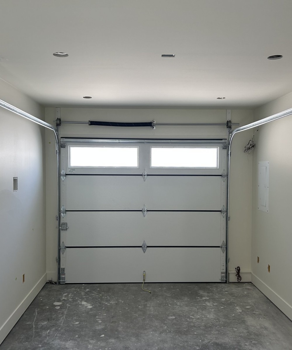 Amarr Olympus OL3200 black garage door with glass top sections in Vancouver