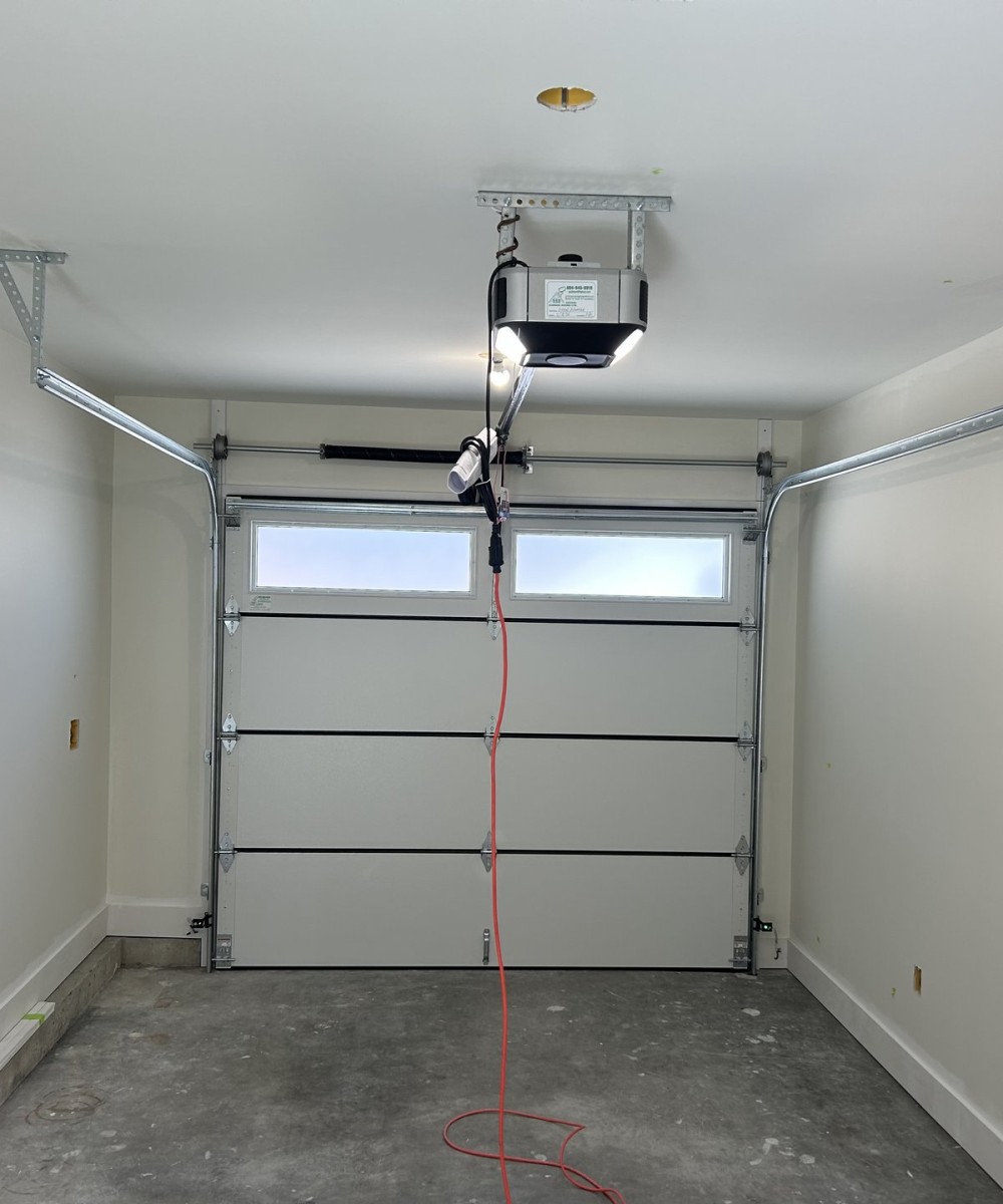 Amarr Olympus OL3200 black garage door with glass top sections in Vancouver