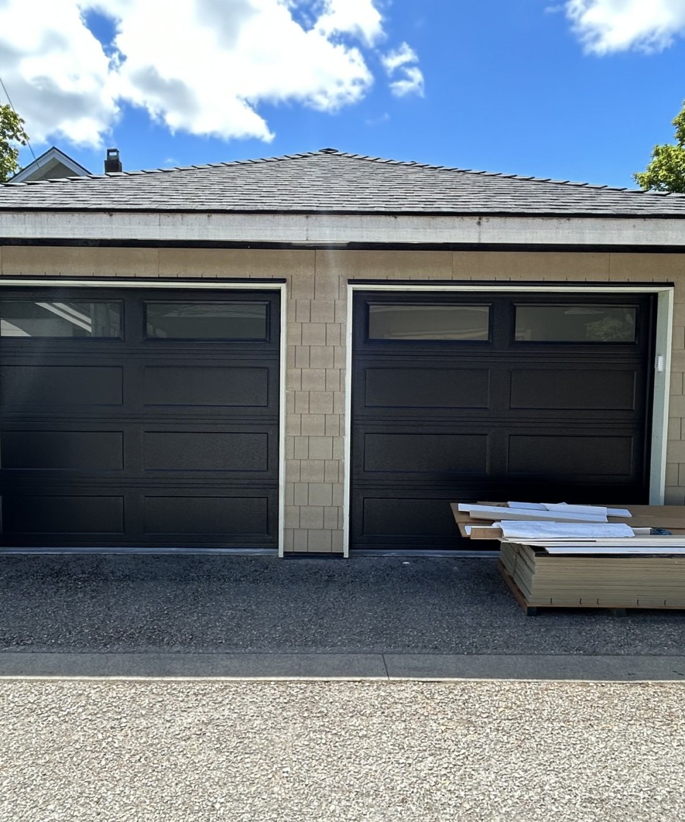 Amarr Olympus OL3200 black garage door with glass top sections in Vancouver