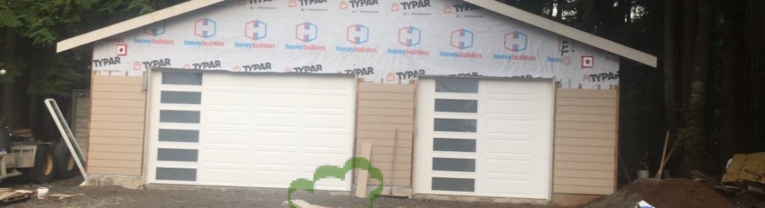 Two Garage Doors Installed in Maple Ridge with Glass Sections